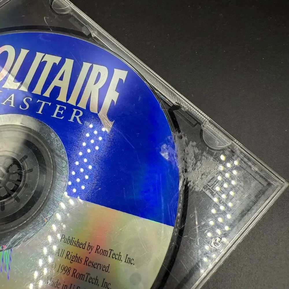 PC Mixed Game Lot of 4 Solitaire Wheel of Fortune Prime Suspects Trophy Bass